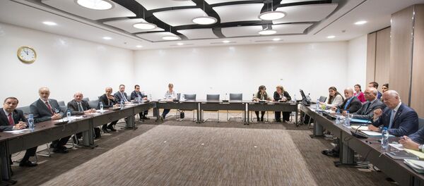 UN Special Envoy of the Secretary-General for Syria Staffan de Mistura (1st R) attends a new round of negotiation with Syrian Ambassador to the United Nations and head of the government delegation Bashar al-Jaafari (2nd L) during the intra-Syrian talks, at Palais des Nations in Geneva, Switzerland, 14 July 2017 - Sputnik International