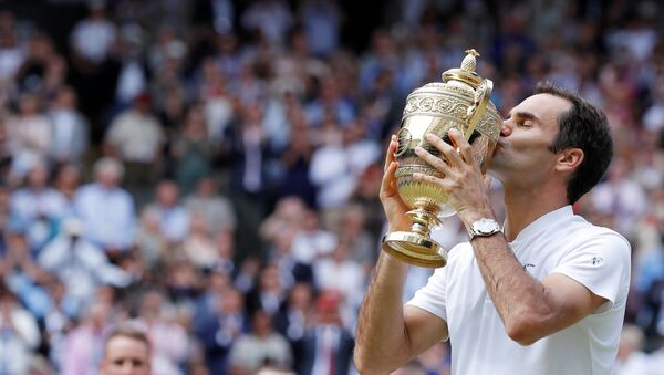 Tennis - Wimbledon - London, Britain - July 16, 2017 Switzerland’s Roger Federer poses with the trophy as he celebrates winning the final against Croatia’s Marin Cilic - Sputnik International