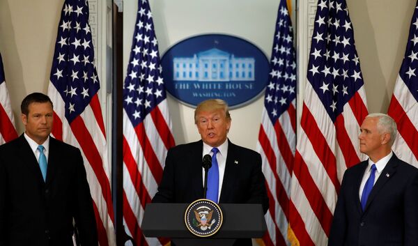 U.S. President Donald Trump speaks at the first meeting of the Presidential Advisory Commission on Election Integrity co-chaired by Kansas Secretary of State Kris Kobach (L) and Vice President Mike Pence (R) at the White House in Washington, U.S., July 19, 2017. U.S. President Donald Trump speaks at the first meeting of the Presidential Advisory Commission on Election Integrity co-chaired by Kansas Secretary of State Kris Kobach (L) and Vice President Mike Pence (R) at the White House in Washington, U.S., July 19, 2017. - Sputnik International