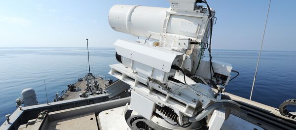 The Afloat Forward Staging Base (Interim) USS Ponce (ASB(I) 15) conducts an operational demonstration of the Office of Naval Research (ONR)-sponsored Laser Weapon System (LaWS) while deployed to the Arabian Gulf. - Sputnik International