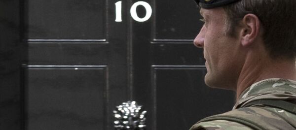 An armed member of the British Army patrols outside 10 Downing Street, London. An armed member of the British Army patrols outside 10 Downing Street, London. - Sputnik International