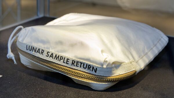 The Apollo 11 Contingency Lunar Sample Return Bag used by astronaut Neil Armstrong, to be offered at auction, is displayed at Sotheby's, in New York. The bag containing traces of moon dust is heading to auction - surrounded by some fallout from a galactic court battle. - Sputnik International