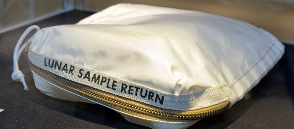 The Apollo 11 Contingency Lunar Sample Return Bag used by astronaut Neil Armstrong, to be offered at auction, is displayed at Sotheby's, in New York. The bag containing traces of moon dust is heading to auction - surrounded by some fallout from a galactic court battle. - Sputnik International
