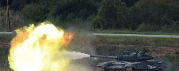 A T-90 tank shoots during a demo exercise at Alabino base. File photo A T-90 tank shoots during a demo exercise at Alabino base. File photo - Sputnik International
