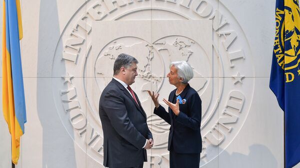 President Petro Poroshenko and Christine Lagarde, Managing Director of the International Monetary Fund, at a meeting. The image is a handout provided by a third party - Sputnik International