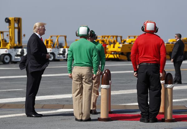 President Donald Trump pauses on the flight deck as he arrives for the commissioning ceremony of the aircraft carrier USS Gerald R. Ford (CVN 78) at Naval Station Norfolk, Va., Saturday, July, 22, 2017. President Donald Trump pauses on the flight deck as he arrives for the commissioning ceremony of the aircraft carrier USS Gerald R. Ford (CVN 78) at Naval Station Norfolk, Va., Saturday, July, 22, 2017. - Sputnik International