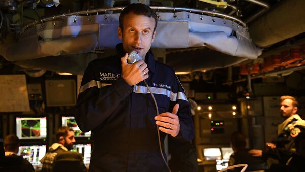 French president Emmanuel Macron speaks to the Captain and crew of the submarine Le Terrible from the operations centre of the vessel, whilst at sea on July 4, 2017 - Sputnik International