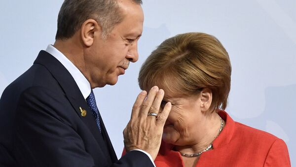 German Chancellor Angela Merkel, right, greets Turkey's President Recep Tayyip Erdogan at the beginning of the G-20 meeting in Hamburg, northern Germany, on Friday, July 7, 2017 - Sputnik International