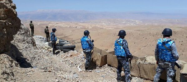 Fighters from the Syrian army units and Hezbollah are seen on the western mountains of Qalamoun, near Damascus, in this handout picture provided by SANA on July 23, 2017, Syria - Sputnik International