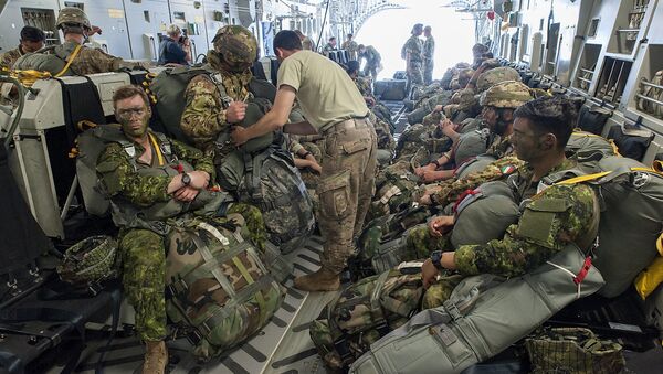 Paratroopers prepare for deployment onboard a US aircraft during the Swift Response 2017 international military exercise at Papa Airbase near Papa, 146 kms southwest of Budapest, Hungary, Tuesday, July 18, 2017. Swift Response is part of the Saber Guardian 2017 (SG17) multinational military exercise held annually in the Black Sea Region as part of the U.S. European Command Joint Exercise Program. The lead organizations for Saber Guardian 2017 are U.S. Army Europe and the Bulgarian Armed Forces. SG17 is co-hosted by the Bulgarian, Hungarian and Romanian land force components and it takes place in numerous locations across Bulgaria, Hungary and Romania in the summer of 2017 - Sputnik International