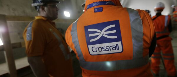 Workers talk as tunnel boring machine Victoria breaks into the eastern end of the Liverpool Street Crossrail station in London, Tuesday, March 10, 2015. Workers talk as tunnel boring machine Victoria breaks into the eastern end of the Liverpool Street Crossrail station in London, Tuesday, March 10, 2015. - Sputnik International