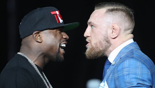 Floyd Mayweather and Conor McGregor stare each other down during a world tour press conference to promote the upcoming Mayweather vs McGregor boxing fight at Budweiser Stage. - Sputnik International