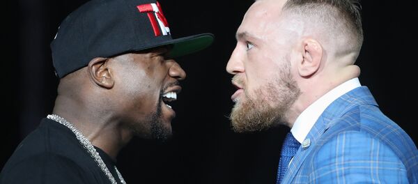 Floyd Mayweather and Conor McGregor stare each other down during a world tour press conference to promote the upcoming Mayweather vs McGregor boxing fight at Budweiser Stage. Floyd Mayweather and Conor McGregor stare each other down during a world tour press conference to promote the upcoming Mayweather vs McGregor boxing fight at Budweiser Stage. - Sputnik International
