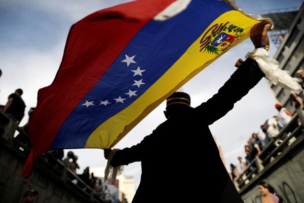 Opposition supporters attend a rally to pay tribute to victims of violence during protests against Venezuelan President Nicolas Maduro's government in Caracas, Venezuela, July 24, 2017. Opposition supporters attend a rally to pay tribute to victims of violence during protests against Venezuelan President Nicolas Maduro's government in Caracas, Venezuela, July 24, 2017. - Sputnik International