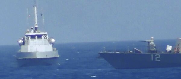 This handout image provided Tuesday, July 25, 2017, from the U.S. Navy purports to show an Iranian vessel making a close approach to a U.S. coastal patrol ship USS Thunderbolt, right. The U.S. Navy patrol boat fired warning shots near the Iranian vessel that American sailors said came dangerously close to them during a tense encounter in the Persian Gulf. This handout image provided Tuesday, July 25, 2017, from the U.S. Navy purports to show an Iranian vessel making a close approach to a U.S. coastal patrol ship USS Thunderbolt, right. The U.S. Navy patrol boat fired warning shots near the Iranian vessel that American sailors said came dangerously close to them during a tense encounter in the Persian Gulf. - Sputnik International