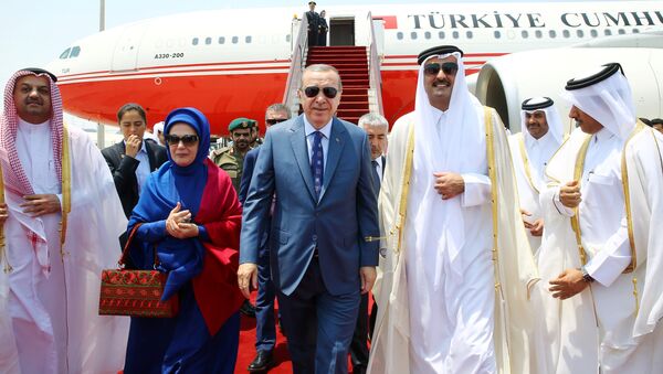 Turkish President Tayyip Erdogan, accompanied by his wife Emine Erdogan, is welcomed by Emir of Qatar Sheikh Tamim Bin Hamad Al-Thani in Doha, Qatar, July 24, 2017. - Sputnik International