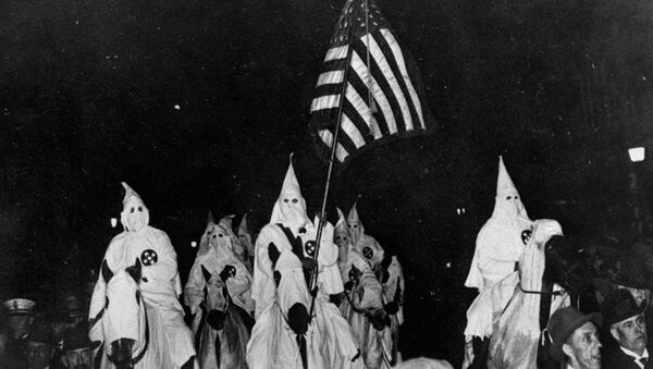 In this September 21, 1923 file photo, members of the Ku Klux Klan ride horses during a parade through the streets of Tulsa, Okla. - Sputnik International