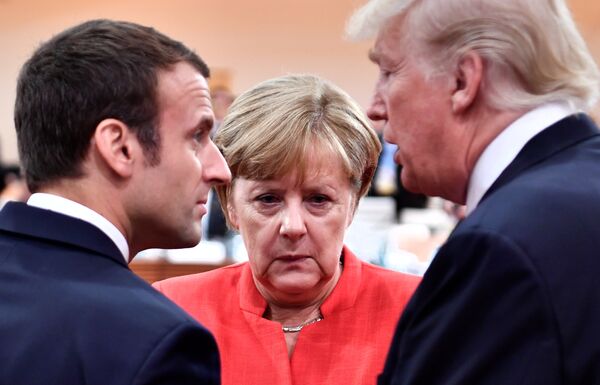 French President Emmanuel Macron, German Chancellor Angela Merkel and US President Donald Trump confer at the start of the first working session of the G20 meeting in Hamburg, Germany, July 7, 2017. French President Emmanuel Macron, German Chancellor Angela Merkel and US President Donald Trump confer at the start of the first working session of the G20 meeting in Hamburg, Germany, July 7, 2017. - Sputnik International