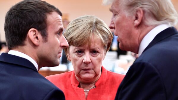 French President Emmanuel Macron, German Chancellor Angela Merkel and US President Donald Trump confer at the start of the first working session of the G20 meeting in Hamburg, Germany, July 7, 2017. - Sputnik International