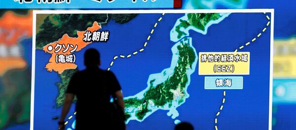 Men walk past a street monitor showing news of North Korea's intercontinental ballistic missile test in Tokyo, Japan. (File) Men walk past a street monitor showing news of North Korea's intercontinental ballistic missile test in Tokyo, Japan. (File) - Sputnik International