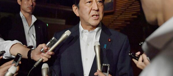 Japanese Prime Minister Shinzo Abe speaks to reporters about North Korea's missile launch in Tokyo, Japan in this photo taken by Kyodo on July 29, 2017 - Sputnik International