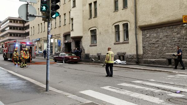 Police and rescue personnel are seen at the scene of an accident in downtown Helsinki where an intoxicated man hit people with his car, in Helsinki, Finland July 28, 2017. - Sputnik International