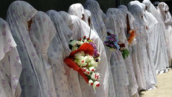 Brides stand together during a mass marriage ceremony in Herat province west of Kabul, Afghanistan - Sputnik International