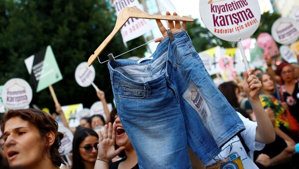 Women rights activists display shorts with a slogan that reads: Don't Mess With My Outfit during a protest against what they say are violence and animosity they face from men demanding they dress more conservatively, in Istanbul, Turkey, July 29, 2017 - Sputnik International