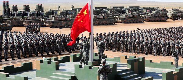 Soldiers of China's People's Liberation Army (PLA) raise a Chinese national flag during the military parade to commemorate the 90th anniversary of the foundation of the army at Zhurihe military training base in Inner Mongolia Autonomous Region, China, July 30, 2017 - Sputnik International