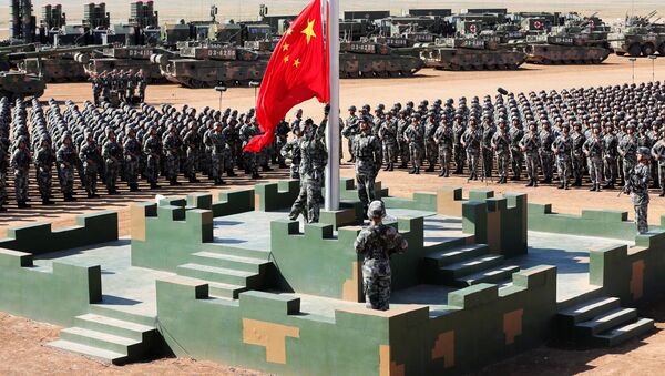 Soldiers of China's People's Liberation Army (PLA) raise a Chinese national flag during the military parade to commemorate the 90th anniversary of the foundation of the army at Zhurihe military training base in Inner Mongolia Autonomous Region, China, July 30, 2017 - Sputnik International