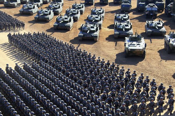 In this photo released by China's Xinhua News Agency, Chinese People's Liberation Army (PLA) troops march past military vehicles Sunday, July 30, 2017 as they arrive for a military parade to commemorate the 90th anniversary of the founding of the PLA on Aug. 1 at Zhurihe training base in north China's Inner Mongolia Autonomous Region - Sputnik International