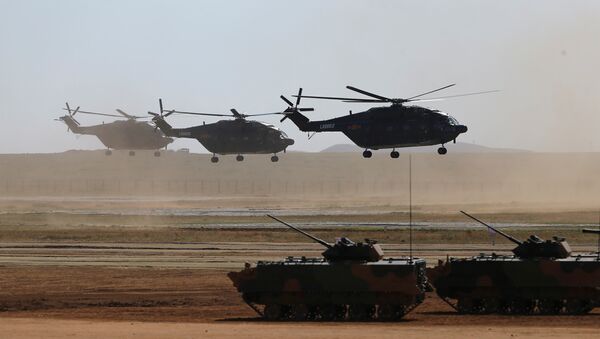 Helicopters and armoured vehicles participate in the military parade to commemorate the 90th anniversary of the foundation of the China's People's Liberation Army (PLA) at Zhurihe military training base in Inner Mongolia Autonomous Region, China, July 30, 2017 - Sputnik International