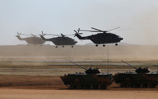 Helicopters and armoured vehicles participate in the military parade to commemorate the 90th anniversary of the foundation of the China's People's Liberation Army (PLA) at Zhurihe military training base in Inner Mongolia Autonomous Region, China, July 30, 2017 - Sputnik International