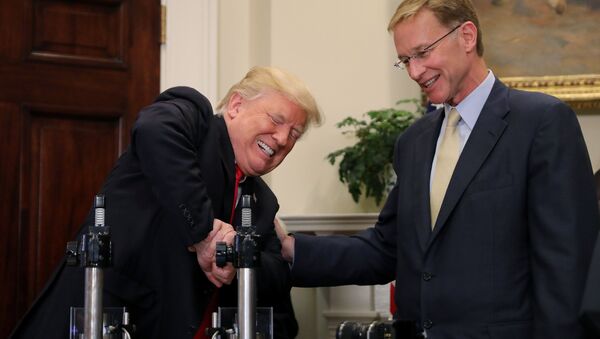 U.S. President Donald Trump participates in a strength vial test accompanied by Corning Pharmaceutical Glass Chairman and CEO Wendell Weeks during a Made in America event on pharmaceutical glass manufacturing, at the Roosevelt Room of the White House in Washington, U.S., July 20, 2017 - Sputnik International