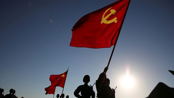 Soldiers carry a PLA flag and Chinese national flags before the military parade to commemorate the 90th anniversary of the foundation of China's People's Liberation Army (PLA) at Zhurihe military base in Inner Mongolia Autonomous Region, China, July 30, 2017 - Sputnik International