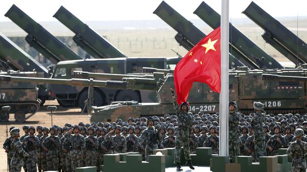 In this photo released by China's Xinhua News Agency, Chinese People's Liberation Army (PLA) troops perform a flag raising ceremony Sunday, July 30, 2017 for a military parade to commemorate the 90th anniversary of the founding of the PLA on Aug. 1 at Zhurihe training base in north China's Inner Mongolia Autonomous Region - Sputnik International