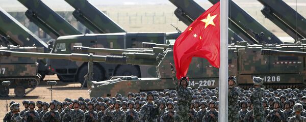 In this photo released by China's Xinhua News Agency, Chinese People's Liberation Army (PLA) troops perform a flag raising ceremony Sunday, July 30, 2017 for a military parade to commemorate the 90th anniversary of the founding of the PLA on Aug. 1 at Zhurihe training base in north China's Inner Mongolia Autonomous Region In this photo released by China's Xinhua News Agency, Chinese People's Liberation Army (PLA) troops perform a flag raising ceremony Sunday, July 30, 2017 for a military parade to commemorate the 90th anniversary of the founding of the PLA on Aug. 1 at Zhurihe training base in north China's Inner Mongolia Autonomous Region - Sputnik International