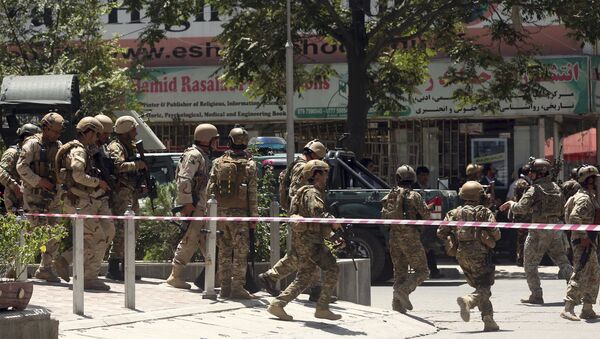 Security forces respond at the site of a suicide attack followed by a clash between Afghanistan's forces and IS fighters during an attack on Iraq embassy in Kabul, Afghanistan, Monday, July 31, 2017 - Sputnik International