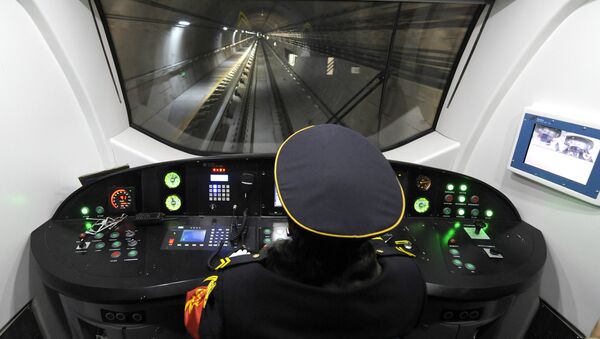 A driver operates a metro car runing through the newly-opened subway line in Beijing on December 30, 2010 - Sputnik International