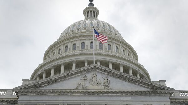 In this May 4, 2017, file photo, the U.S. flag flies in front of the Capitol dome on Capitol Hill in Washington - Sputnik International