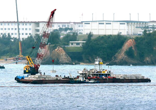 A crane barge works in the Henoko coastal area in Nago, Okinawa prefecture on February 6, 2017 A crane barge works in the Henoko coastal area in Nago, Okinawa prefecture on February 6, 2017 - Sputnik International