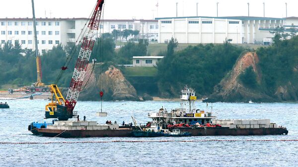 A crane barge works in the Henoko coastal area in Nago, Okinawa prefecture on February 6, 2017 - Sputnik International