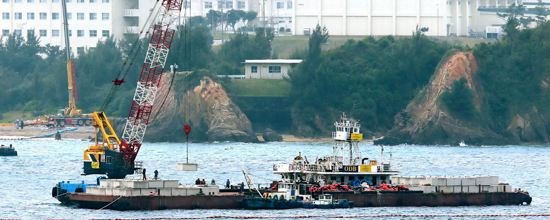 A crane barge works in the Henoko coastal area in Nago, Okinawa prefecture on February 6, 2017 - Sputnik International, 1920, 18.10.2023