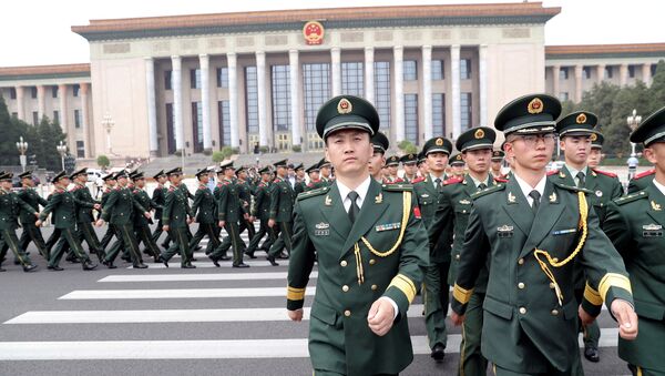 Paramilitary policemen march outside the Great Hall of the People after the ceremony marking the 90th anniversary of the founding of the China's People's Liberation Army in Beijing, China August 1, 2017 - Sputnik International