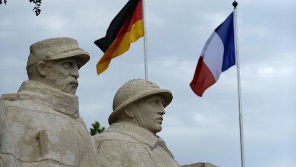 German flag and French flag are pictured in front of the War Memorial 1914-18, on May 27, 2016 in Verdun, eastern France - Sputnik International