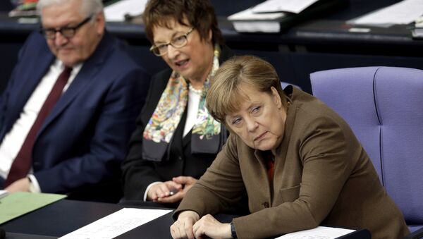 German Chancellor Angela Merkel, right, attends with German Foreign Minister Frank-Walter Steinmeier, left, and State Secretary Brigitte Zypries a meeting of the German Federal Parliament, Bundestag, at the Reichstag building in Berlin, Germany, Thursday, Feb. 25, 2016. - Sputnik International