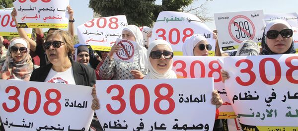 Women activists protest in front Jordan's parliament in Amman on Tuesday, August 1, 2017 with banners calling on legislators to repeal a provision that allows a rapist to escape punishment if he marries his victim Women activists protest in front Jordan's parliament in Amman on Tuesday, August 1, 2017 with banners calling on legislators to repeal a provision that allows a rapist to escape punishment if he marries his victim - Sputnik International