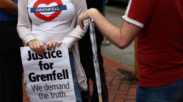 Demonstrators protest against the Grenfell Tower fire outside a Kensington and Chelsea Council meeting at Kensington Town Hall in London, Britain July 19, 2017. - Sputnik International