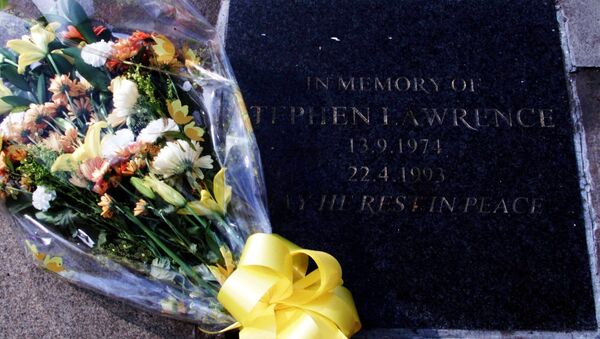 Flowers rest on the memorial plaque to the black teenager Stephen Lawrence, in Eltham located in southeast London Wednesday, March 22, 2000. - Sputnik International