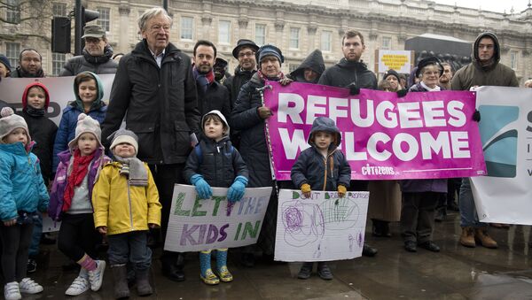 People gather to hear speeches on Whitehall before Lord Alf Dubs (6L) handed in a petition to 10 Downing Street calling on the Prime Minister to reconsider the decision to close the ‘Dubs’ scheme to take refugee children into the UK in London on February 11, 2017 - Sputnik International